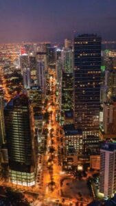 A bustling aerial view of Downtown Miami in the evening.